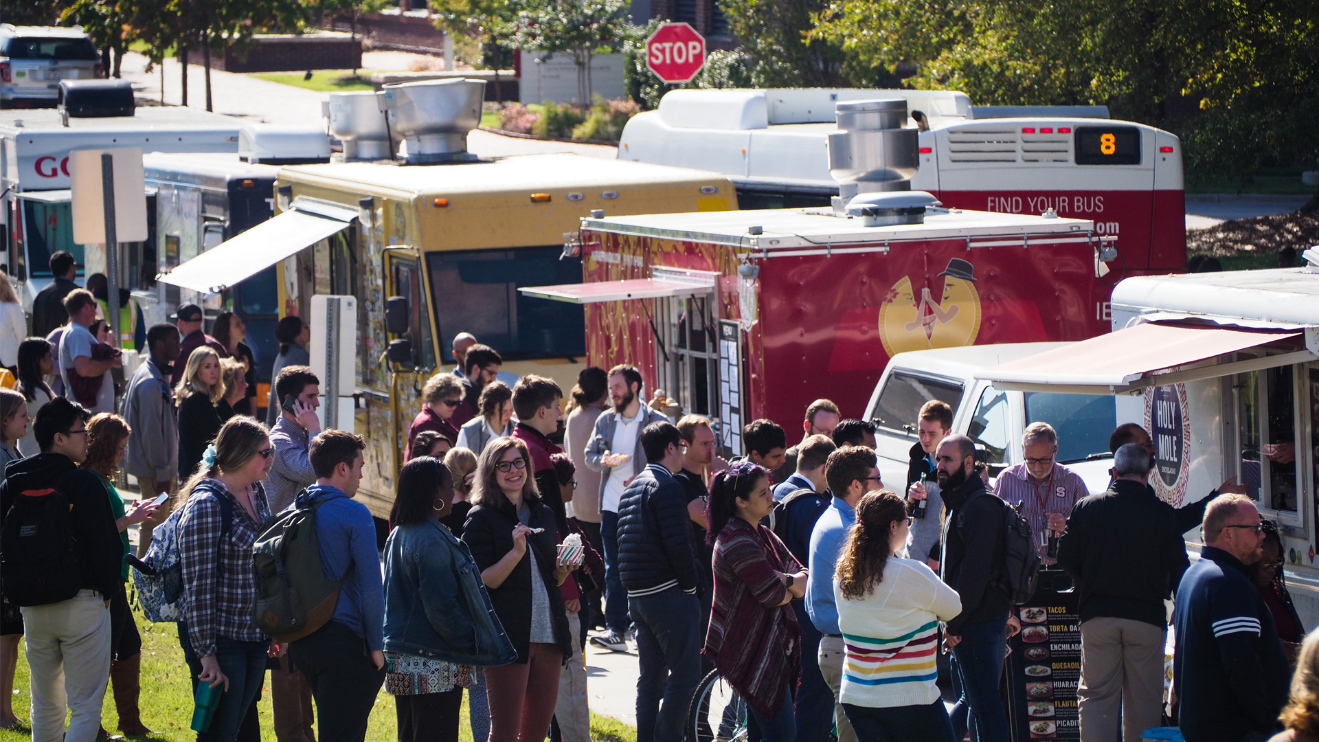 People line up for food trucks parked on Centennial Campus.