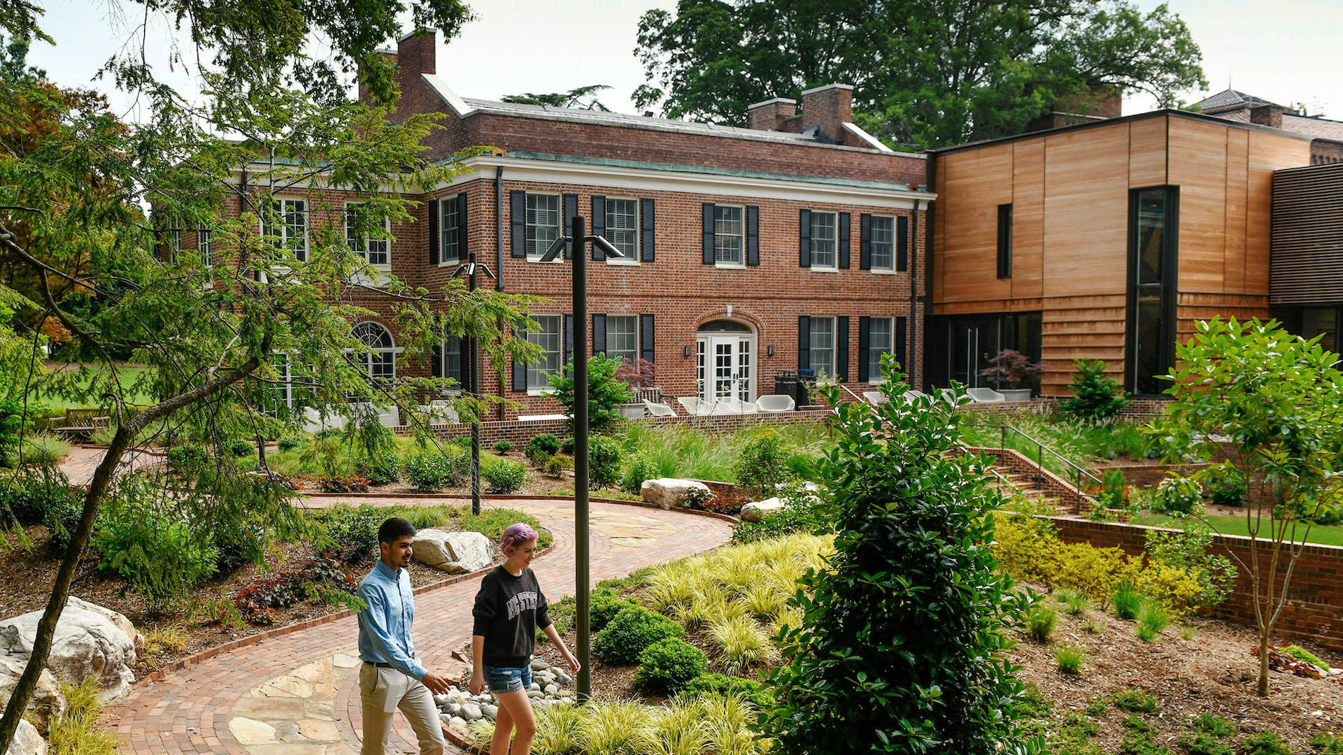 Students walk in the garden surrounding the Gregg Museum.