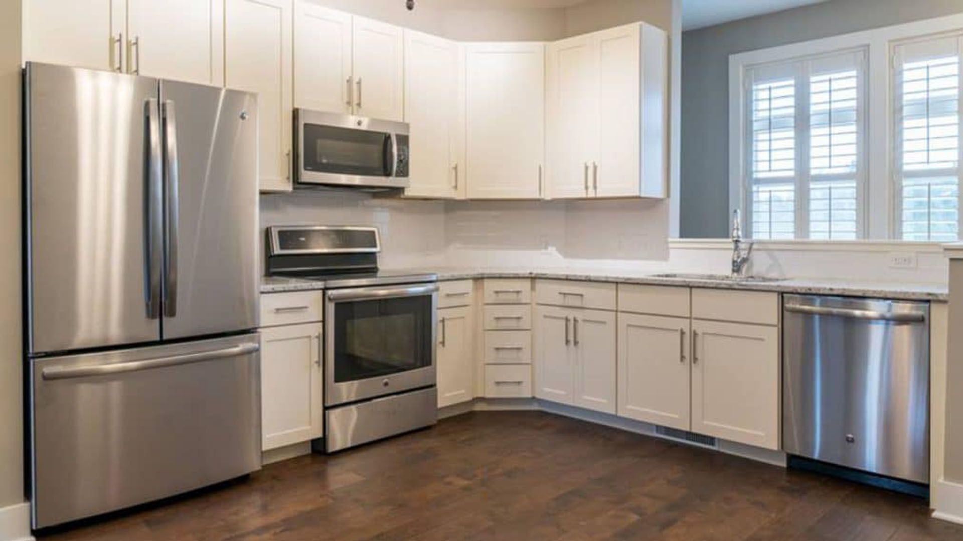 A kitchen with high-end appliances in a North Shore townhome.