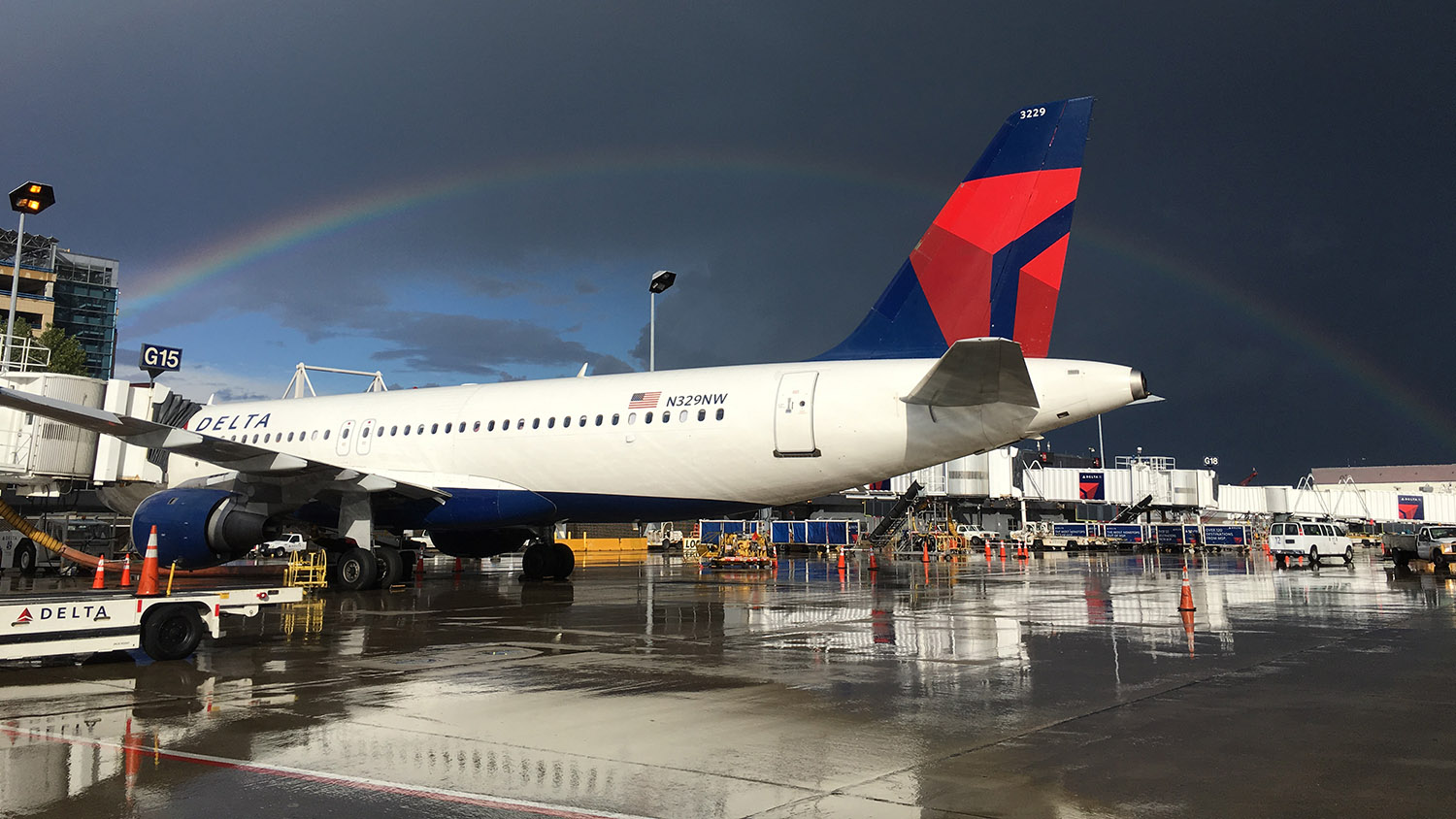 An airplane under a rainbow