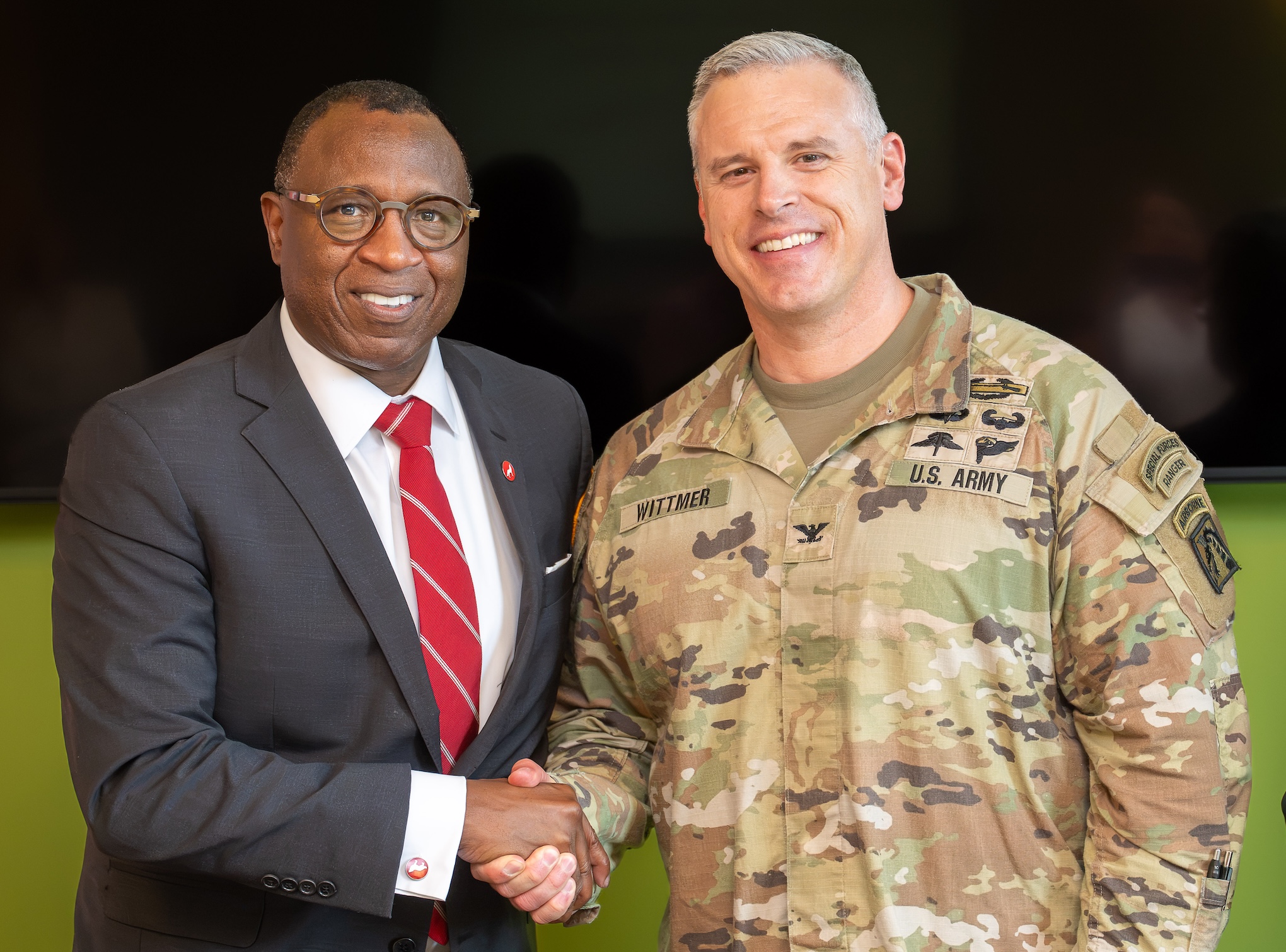 Chancellor Howell and Col. Luke Wittmer shaking hands